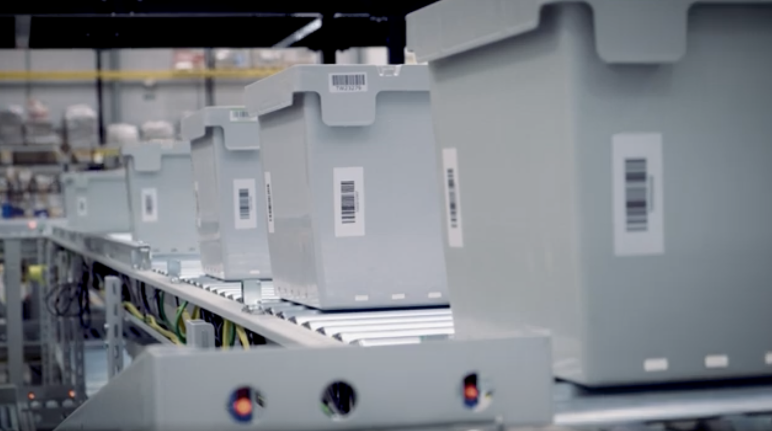 bale arm container on automated warehouse system