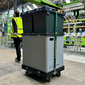 Warehouse operative pulling a Rolling Container