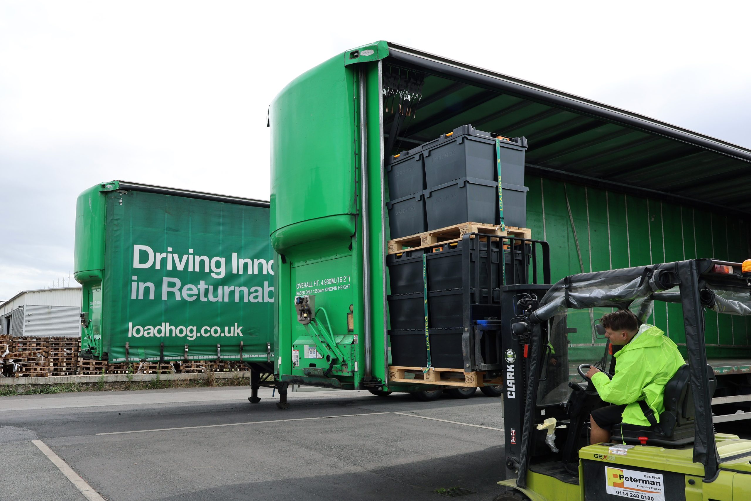 double stacked pallet being fork lifted into the back of a truck