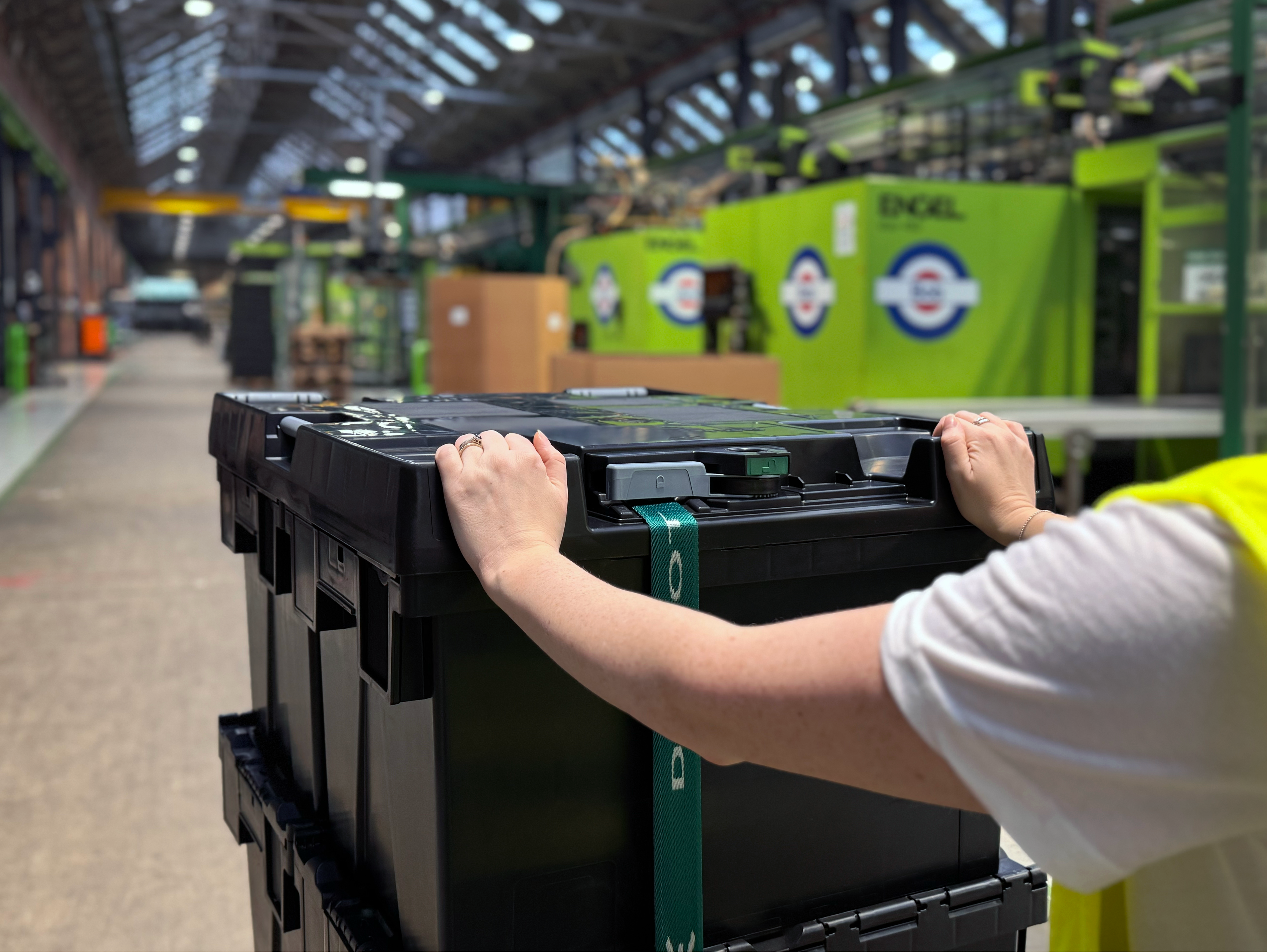 half euro lid being pushed by warehouse operator