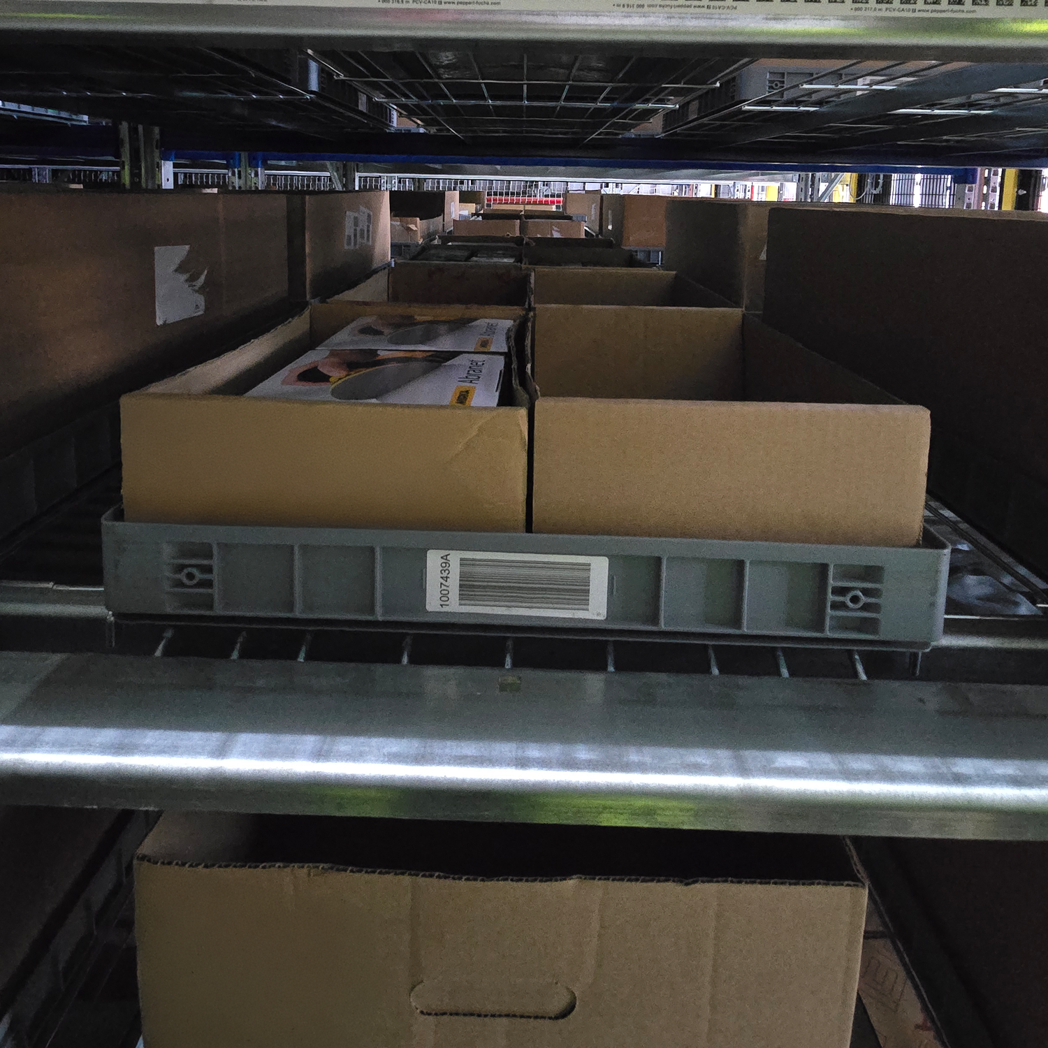 Loadhog automation tray stored within a high-density racking system, demonstrating efficient use of space and seamless integration with automated warehousing solutions.