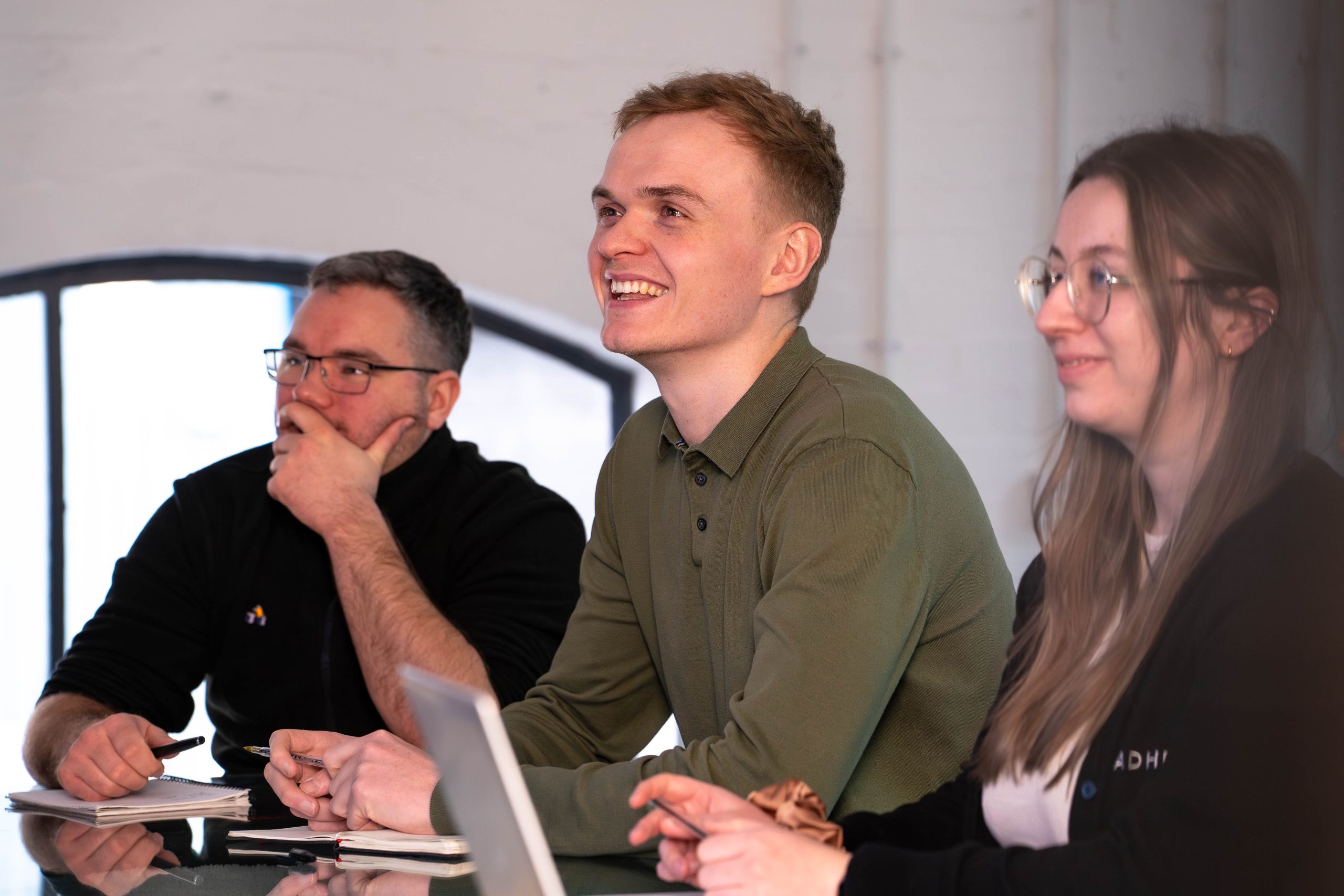 Loadhog employees enjoying a presentation at work